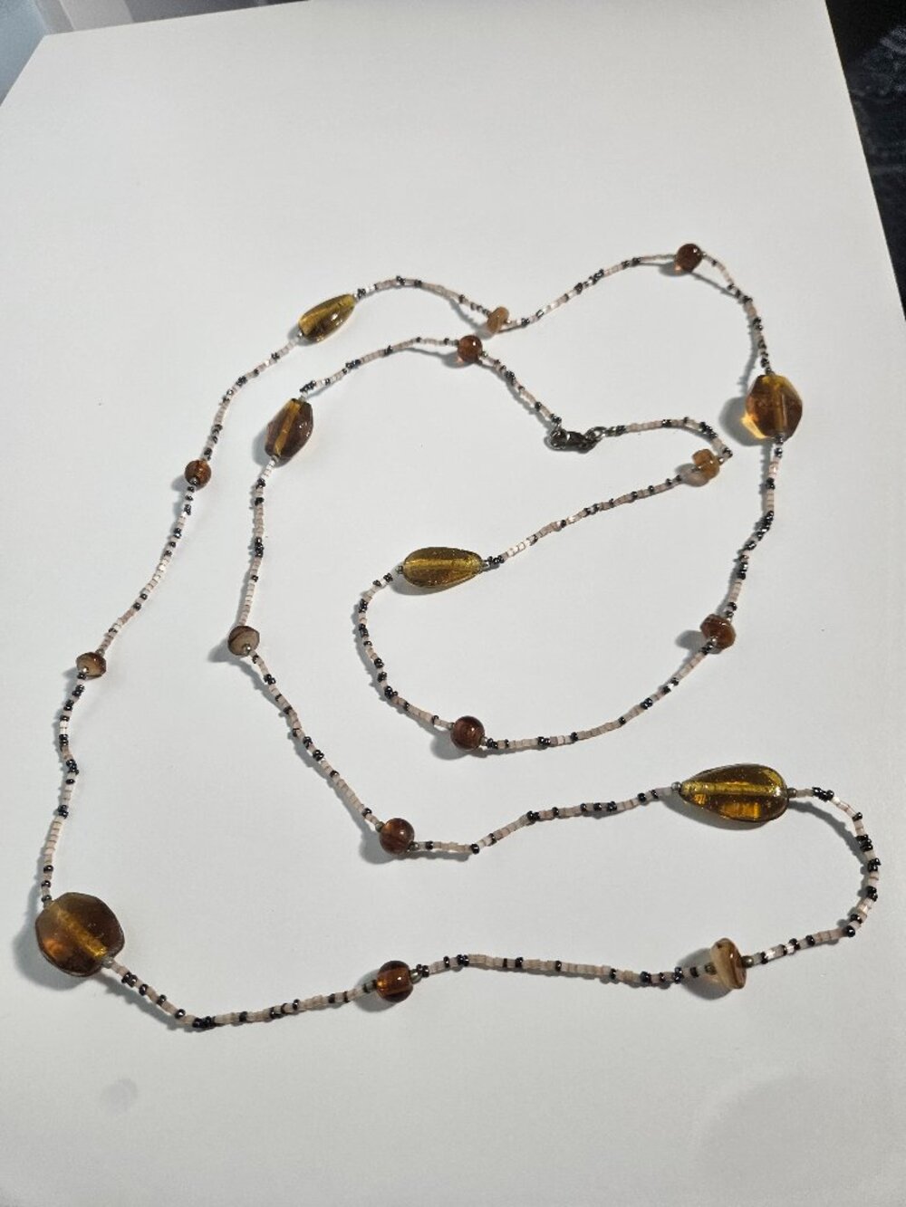 VINTAGE ART DECO NECKLACE, AMBER GLASS AND TAN SEED BEADS, OPERA LENGTH